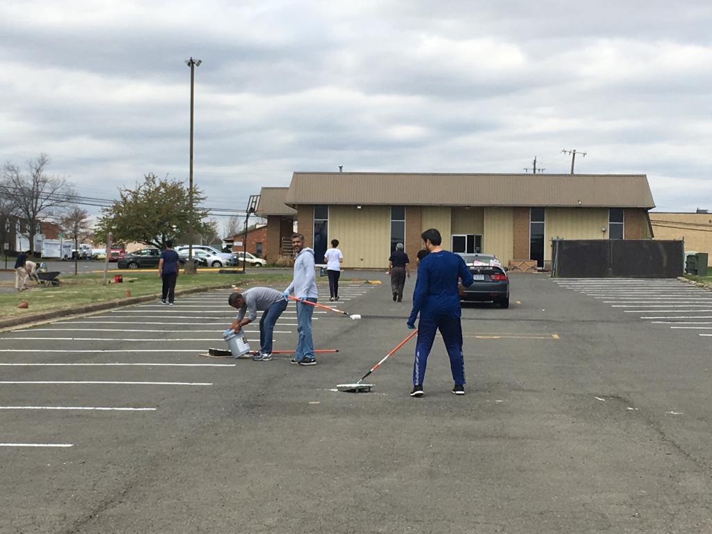 Volunteers fixing parking lines